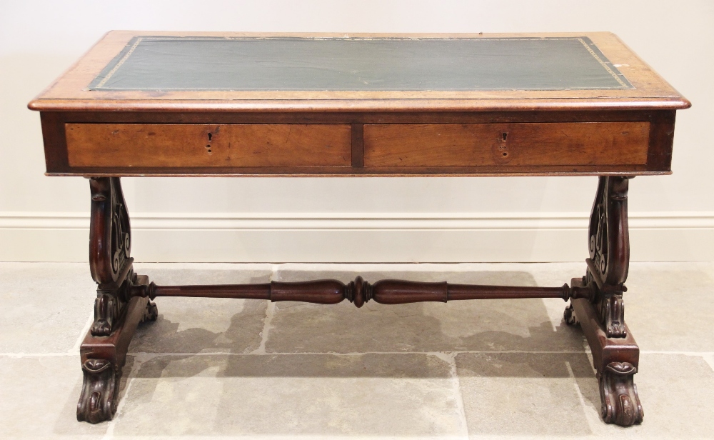 A William IV mahogany writing table, the rectangular moulded top inset with a replaced skiver over