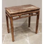 A Chinese stained wood altar table, 20th century, the cleated rectangular top above an inverted