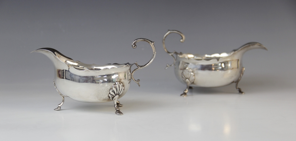 A pair of Victorian silver sauce boats by George Nathan & Ridley Hayes, Birmingham 1893-4, of oval