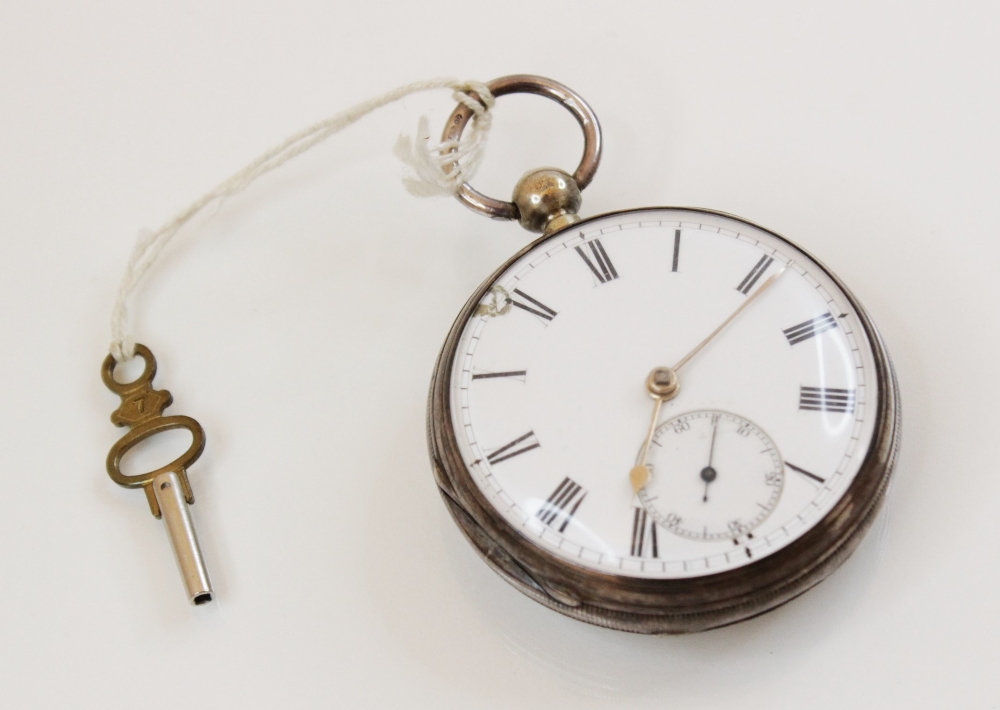 A Victorian silver pocket watch, the round white enamel dial with black Arabic numerals and