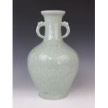 A Chinese Longquan celadon glazed vase, 20th century, the arrow-head type shaped twin handled vase