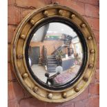 A Regency style circular gilt wood wall mirror