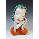 An Art Deco Goldscheider wall mask, early 20th century, modelled as a lady with blue curled hair and