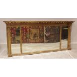 A 19th century Regency style gilt wood over mantel mirror, applied with a gilt sphere frieze over