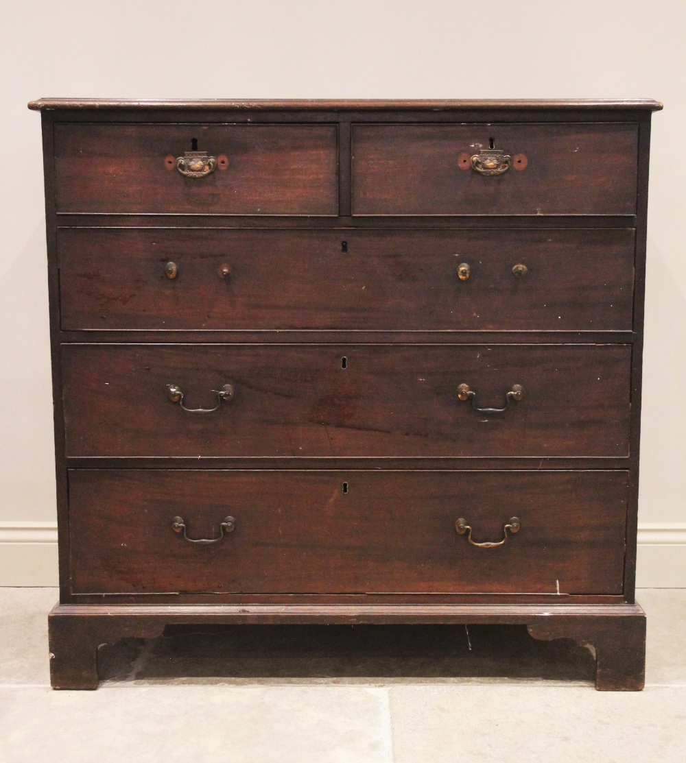 A George III mahogany chest of drawers, the rectangular moulded top above two short and three long