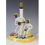 A Italian jazz band table lamp base, mid 20th century, modelled as a banjo player and a bongo