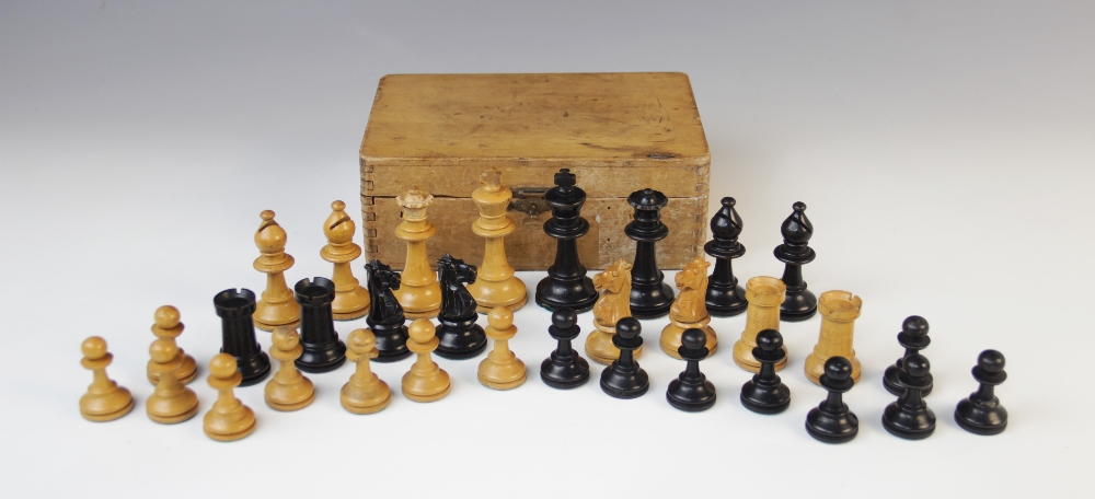 A German Schachklub chess set, early 20th century, of typical form with boxwood and ebony pieces, in