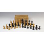A German Schachklub chess set, early 20th century, of typical form with boxwood and ebony pieces, in