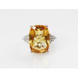 A citrine and diamond 18ct gold ring, the central rectangular mixed cut citrine (measuring 18mm L