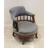 A late Victorian ebonised and burr thuya Aesthetic movement tub chair, the shaped padded back rail