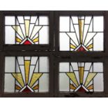 Ten Art Deco stained glass casement window top lights, early 20th century, in painted frames, five