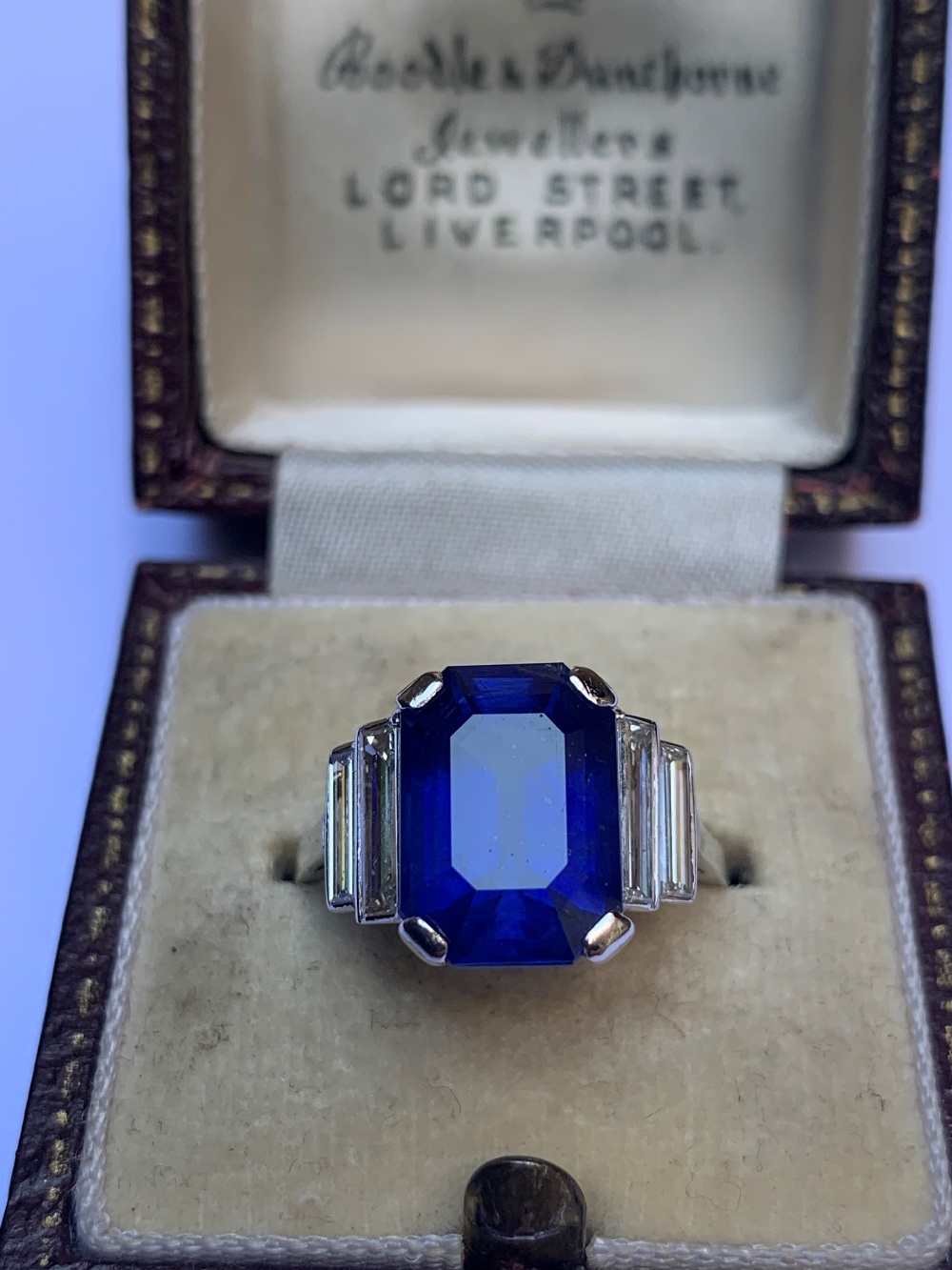 An Art Deco sapphire and diamond ring, the central octagonal step cut sapphire (measuring 11.79mm - Image 4 of 20