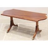 A reproduction mahogany twin pedestal coffee table, by William Tillman, the shaped and cross