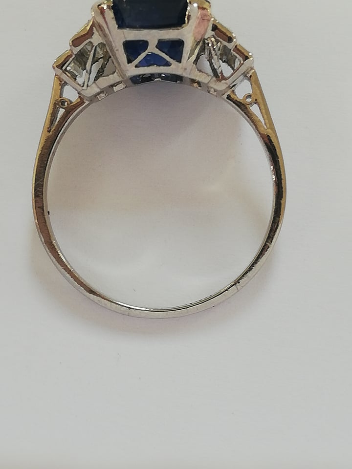 An Art Deco sapphire and diamond ring, the central octagonal step cut sapphire (measuring 11.79mm - Image 16 of 20