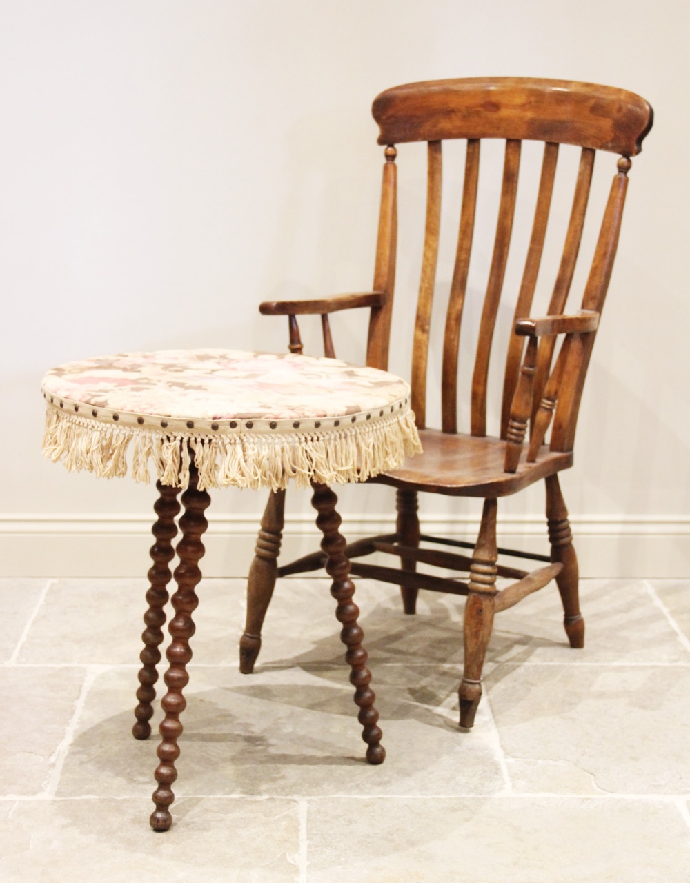 A Victorian elm and beech wood Windsor farmhouse elbow chair, the curvilinear lath back over a