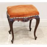 A late 19th century mahogany dressing stool, the serpentine upholstered seat above a shaped apron