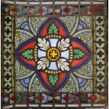 A pair of Victorian trefoil stained glass panels, 19th century, taken from larger church windows,