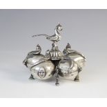 An Indian white metal spice box, comprising five petal form compartments with hinged covers and