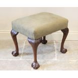 A Chippendale revival dressing stool, mid 20th century, the rectangular upholstered seat raised upon