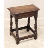 A 17th century style oak joint stool, late 19th century, the rectangular moulded top on ring
