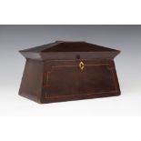 A George III mahogany tea caddy, of sarcophagus form , the pagoda shaped hinged cover centred with