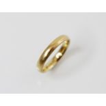 An 18ct gold wedding band, marks for Berker Bros, London, ring size L 1/2, weight 3.5gms