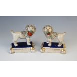 A pair of Staffordshire poodles in the manner of William Kent, late 19th century, each modelled