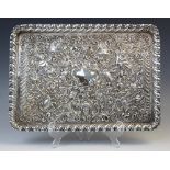 A late Victorian silver tray by William Comyns, London 1898, of rectangular form with gadroon