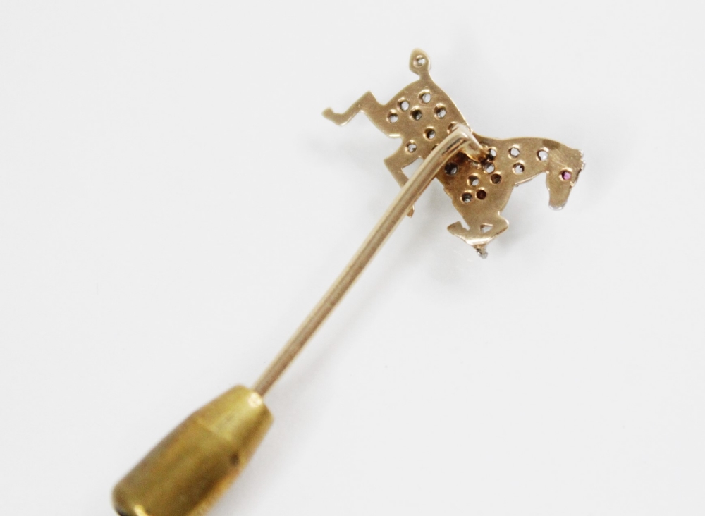 An early 20th century diamond and ruby horse stick pin, the horse modelled in gallop and set with - Image 2 of 4