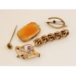 A yellow metal amethyst set Art Nouveau brooch, in the manner of Archibald Knox for Liberty, 3.7cm