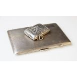 A George V silver cigarette case by E.J. Houlston, Birmingham 1919, of rectangular form with