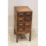 An early 20th century oak eight drawer index cabinet, by D Matthews & Son Ltd, Liverpool, each