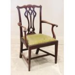 A 19th century Chippendale style mahogany child's elbow chair, the interlaced splat back extending