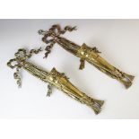 A pair of gilt brass torchere wall sconces, each of conical form with applied ribbon motif between