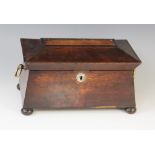 A William IV walnut tea caddy, early 19th century, of sarcophagus form on bun feet with drop ring