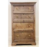 An 18th century and later tall oak chest, formed from four long invert moulded drawers, applied with