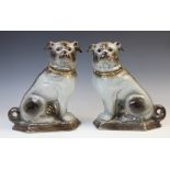 A pair of Staffordshire style Pugs, mid 20th century, naturalistically modelled with grey fur, glass