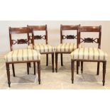A set of six Regency mahogany dining chairs, each with an openwork crest rail centred with a