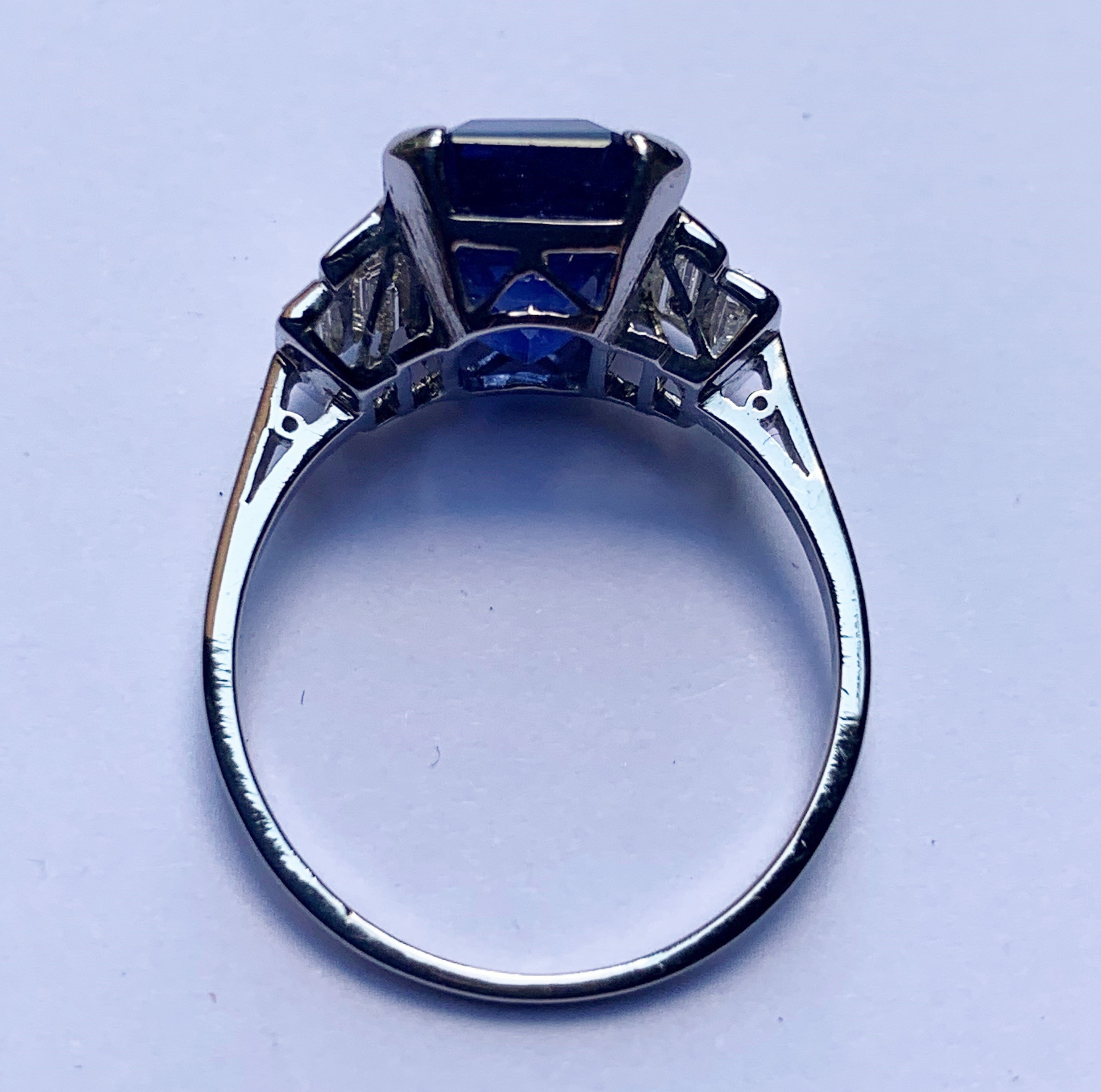 An Art Deco sapphire and diamond ring, the central octagonal step cut sapphire (measuring 11.79mm - Image 3 of 20