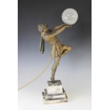 An Art Deco patinated spelter table lamp, early 20th century, modelled as an athletic lady with