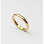 A 22ct gold wedding band, marks for London 1954, ring size M 1/2, weight 3.5gms