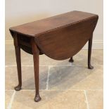 A George III mahogany drop leaf table, the oval top on cylindrical tapering legs terminating in