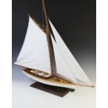 A vintage model of a yacht in full sail, probably mid 20th century, retailed by Nauticalia of