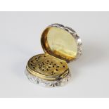 A Victorian silver vinaigrette by Edward Smith, London 1856, of oval form with scalloped borders,