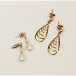 A pair of 9ct gold cultured pearl set drop earrings, each designed as a yellow gold stud