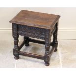 A 17th century style oak joint stool, early 20th century, the rectangular moulded hinged top above a