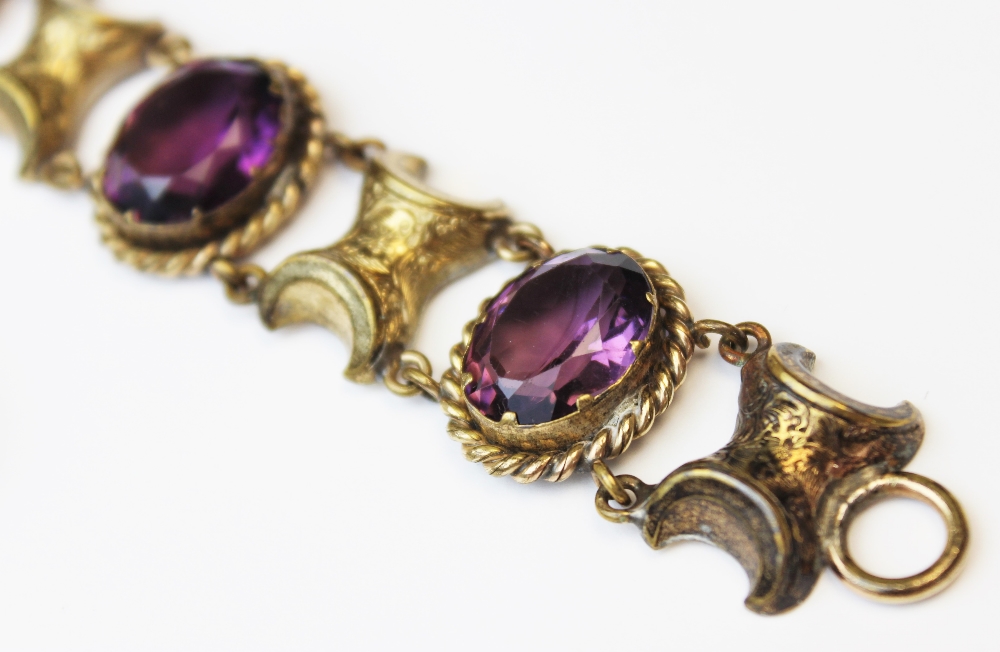 A Victorian style paste set bracelet, comprising four oval mixed cut purple paste, each measuring - Image 2 of 3