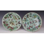 A pair of Chinese porcelain celadon plates, 19th century, each decorated with flora and fauna,