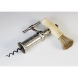 A vintage cork screw and dust brush, 20th century, the nickel plated body with geared turning