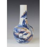 A Chinese porcelain bottle vase, 19th century, decorated in iron red and blue depicting an extensive